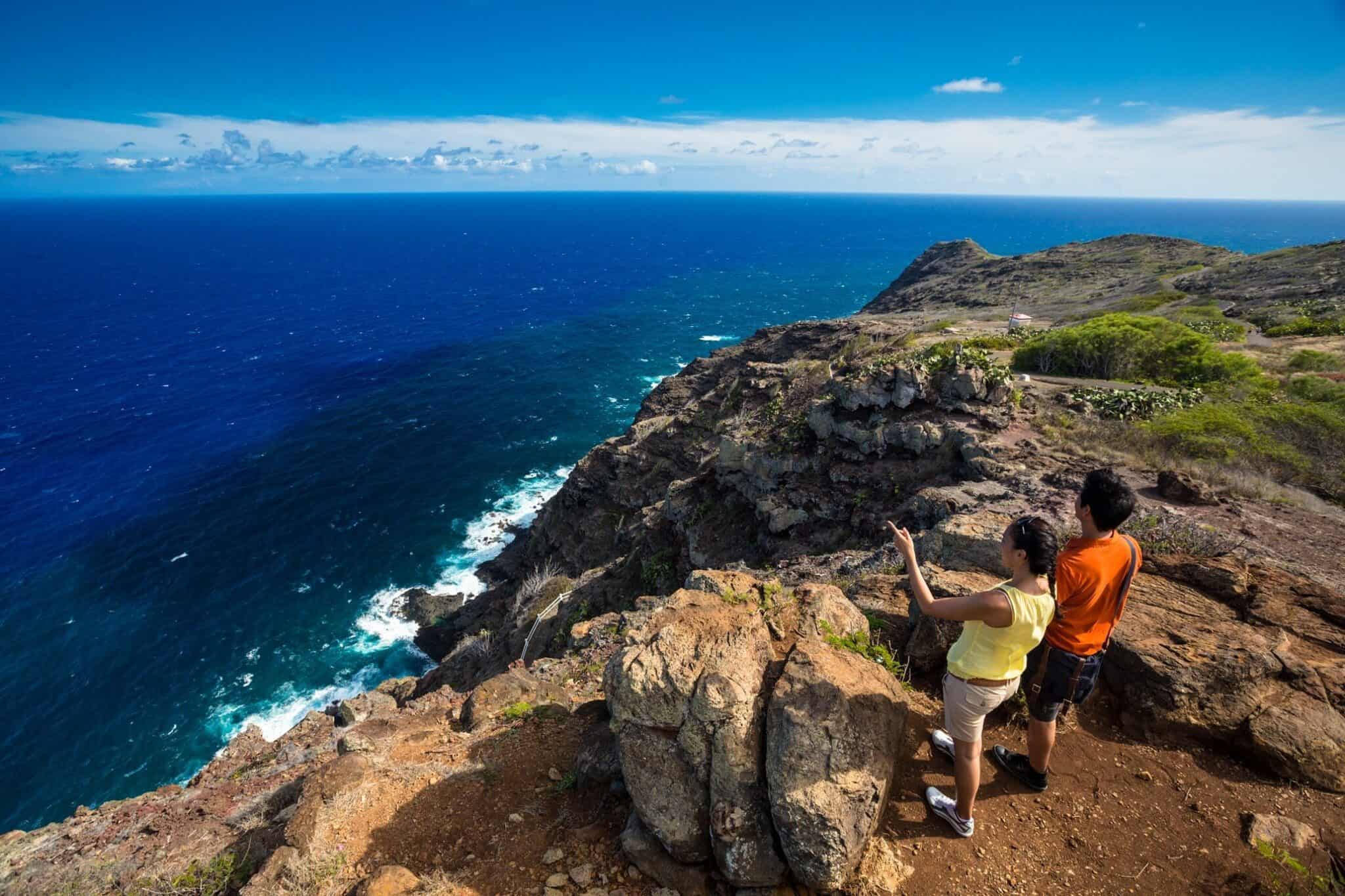 Couple look across the Pacific from Makapuu Trai