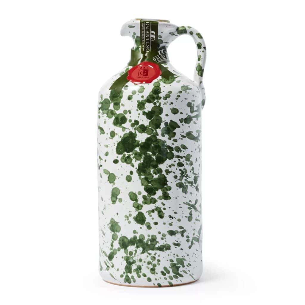 White and green splattered reusable water bottle with a metal handle and red seal, perfect for Mother's Day, isolated on a white background.