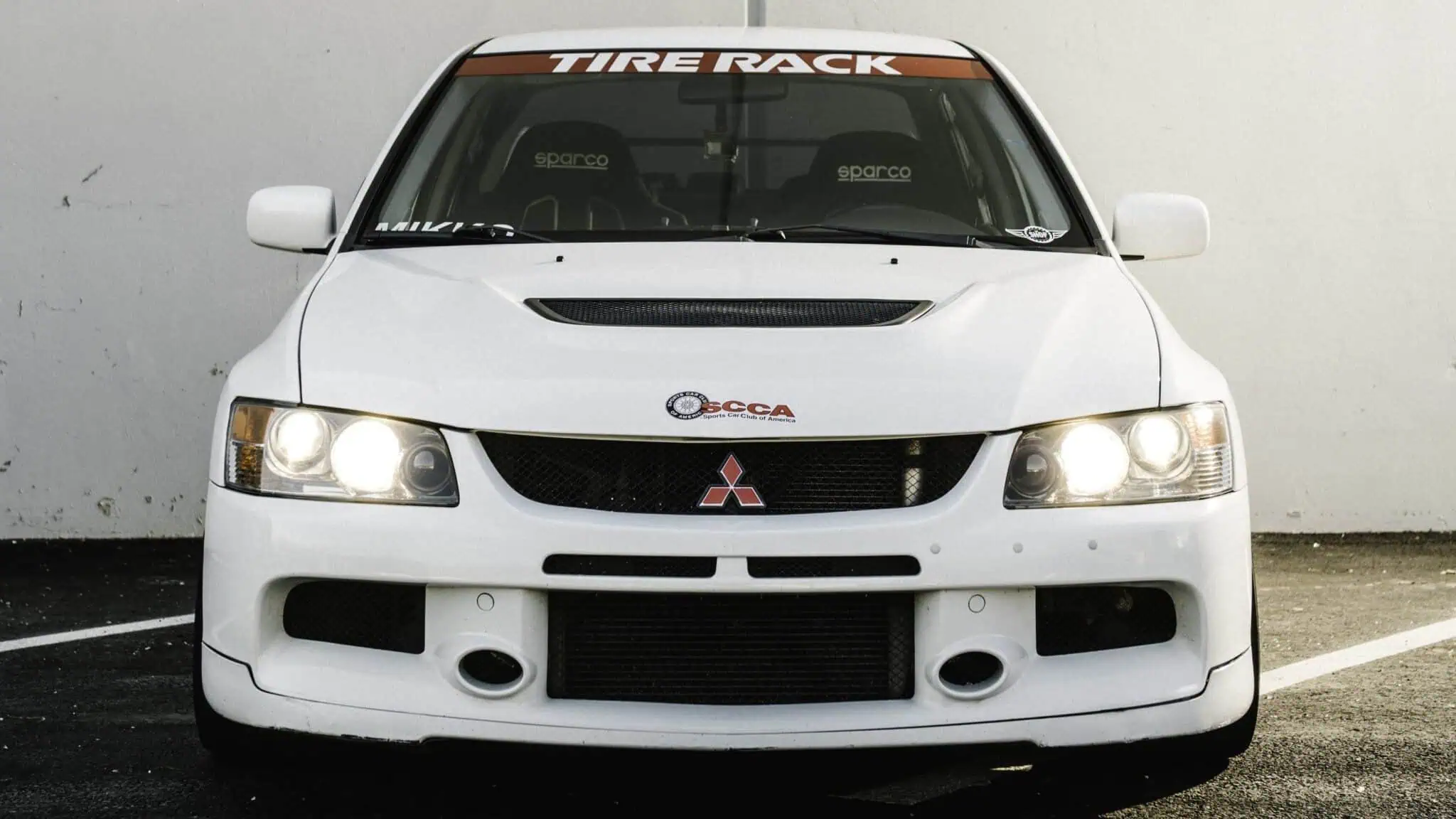 Tasha Mikko’s race car is a 2006 Mitsubishi Evo 9. She named it “Robbie” in honor of her grandfather.