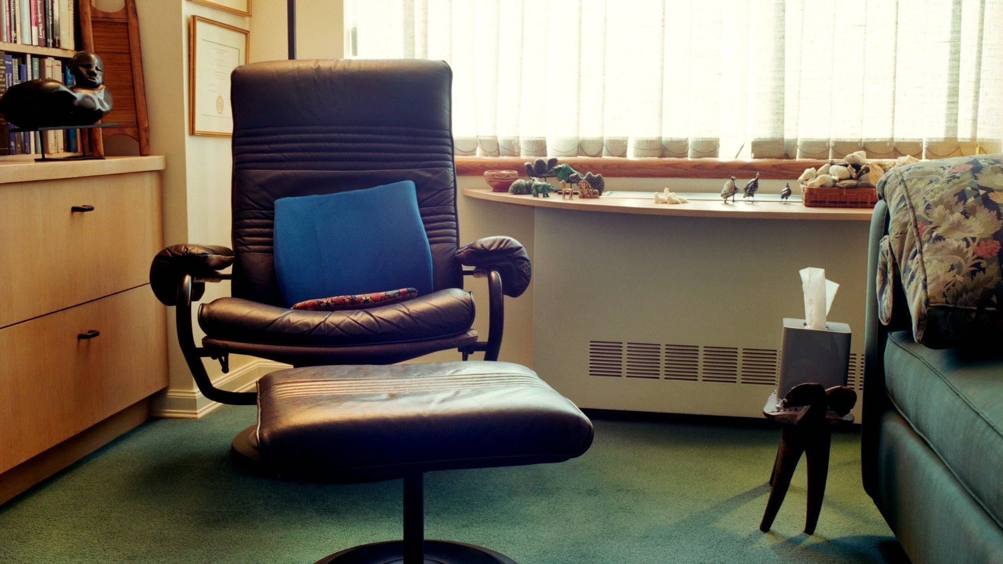 The undisturbed chair in a therapist office.