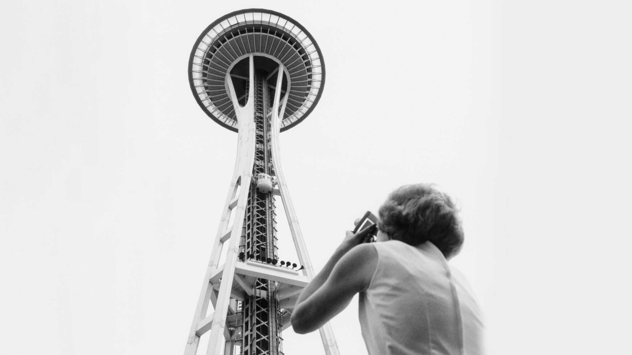 Shirley Farnham taking photo of Space Needle, Seattle World's Fair, 1962

