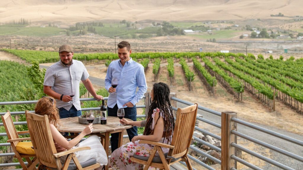 Group of people enjoying a weekend getaway, visiting a tasting room at Red Mountain AVA